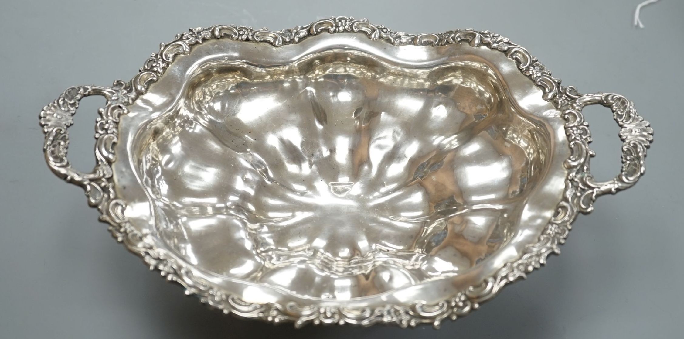 A 19th century Russian 84 zolotnik embossed tow handled fruit bowl, assay master, Dmitri Tvyersko?, 1846, master G.F.R., width, 30.2cm, 12oz.